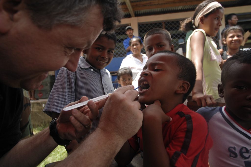 080818-N-9620B-009 BETANIA, Nicaragua (Aug. 18, 2008) U.S. Public Health Service Lt. Cmdr. Gary Brunette cleans and applies fluoride to the teeth of a young Nicaraguan boy so the enamel of his teeth can strengthen over time. Brunette is embarked aboard the amphibious assault ship USS Kearsarge (LHD 3), which is supporting the Caribbean phase of Continuing Promise 2008, an equal-partnership mission between the United States, Canada, the Netherlands, Brazil, Nicaragua, Panama, Colombia, Dominican Republic, Trinidad and Tobago and Guyana. (U.S. Navy photo by Mass Communication Specialist 2nd Class Erik C. Barker/Released)